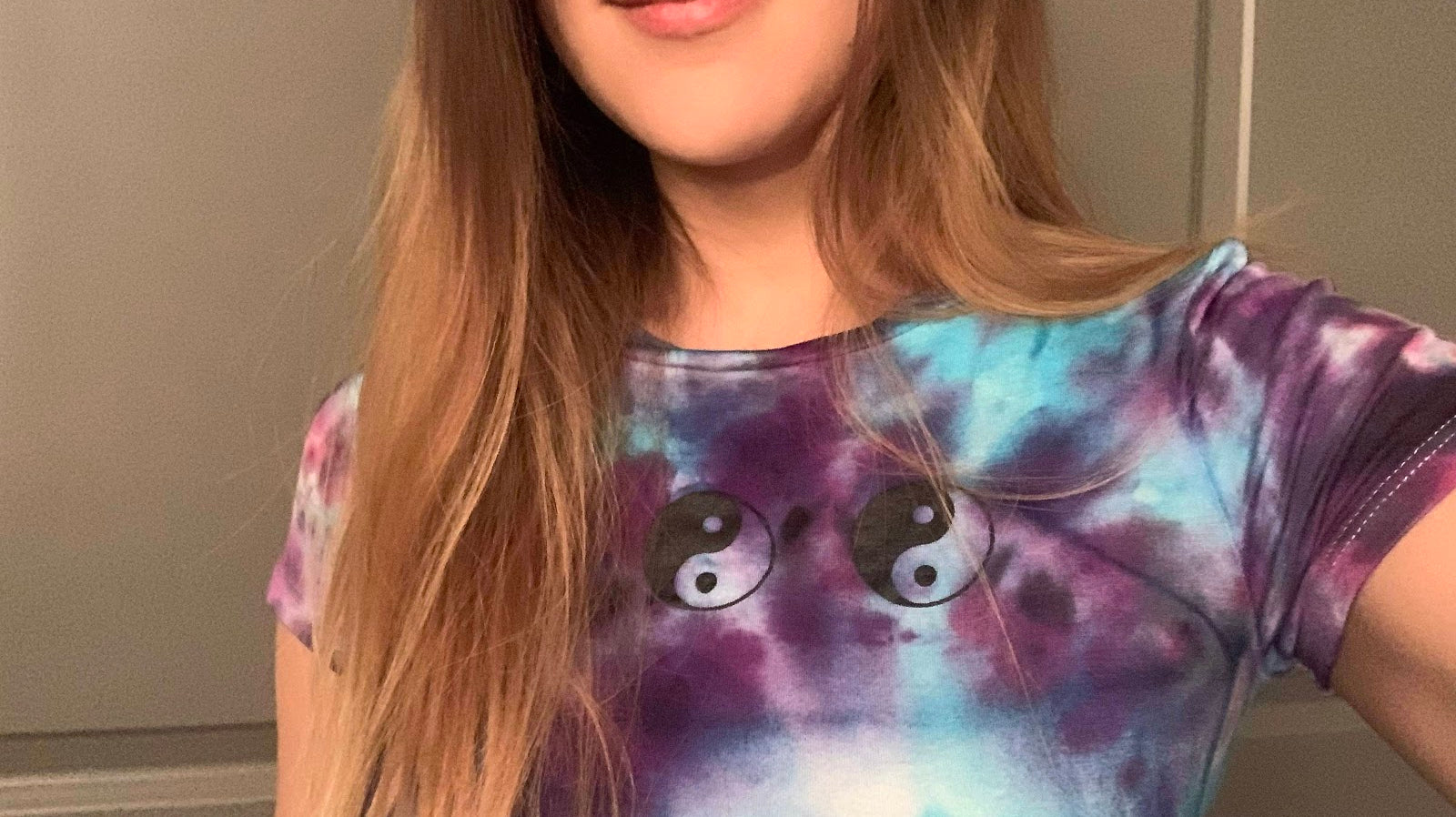 Model wearing Yin and yang tie dye crop top