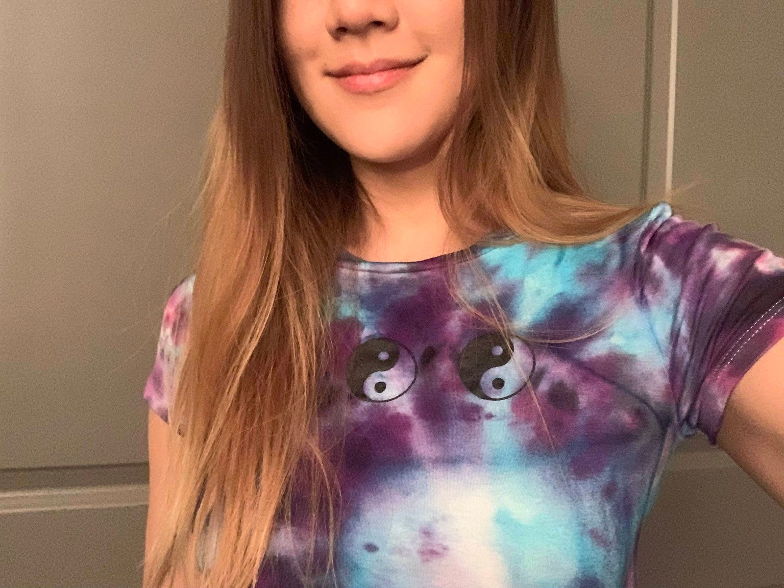 Model wearing Yin and yang tie dye crop top