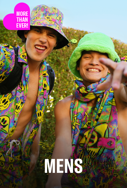 Two people wearing colorful clothing and accessories outdoors with a promotional text overlay.